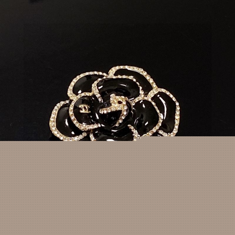 Ch*el brooches